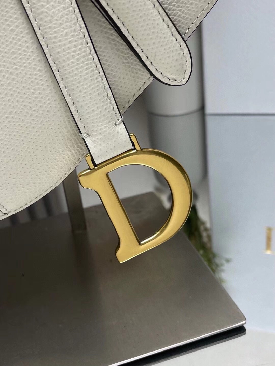 Gold logo hardware of Dior Saddle Bag with Strap White Grained Calfskin