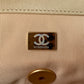 gold microchip hardware inside Chanel 19 handbag in beige lamb skin