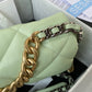 gold and grey chain of Light green large chanel 19 handbag in gold hardware