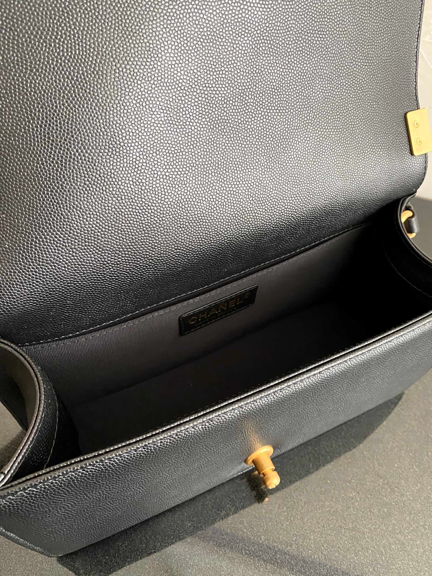 Inside of black boy chanel handbag