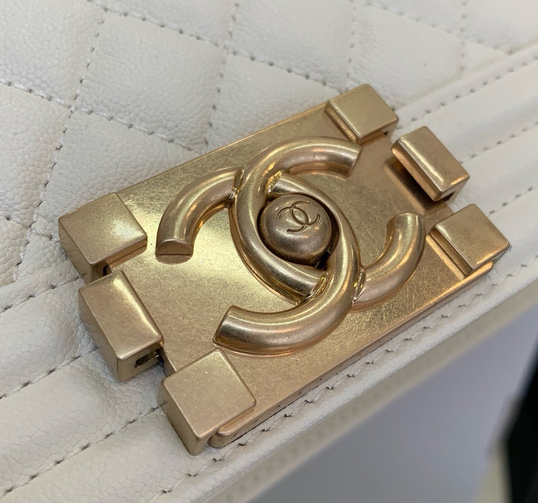 Gold Chanel logo on White boy chanel bag calf skin