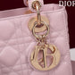 light gold hardware of pink lady dior bag