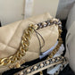 gold and silver tone hardware of Chanel 19 handbag in beige lamb skin