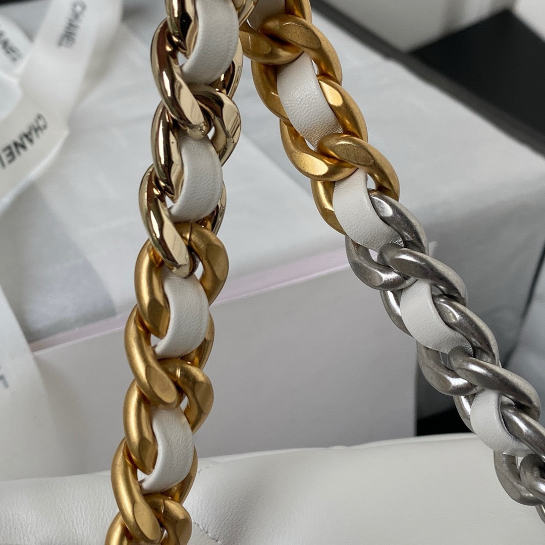 gold and silver chain strap of white chanel 19 handbag in silver hardware lamb skin