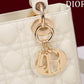 light gold hardware on white patent leather lady dior bag