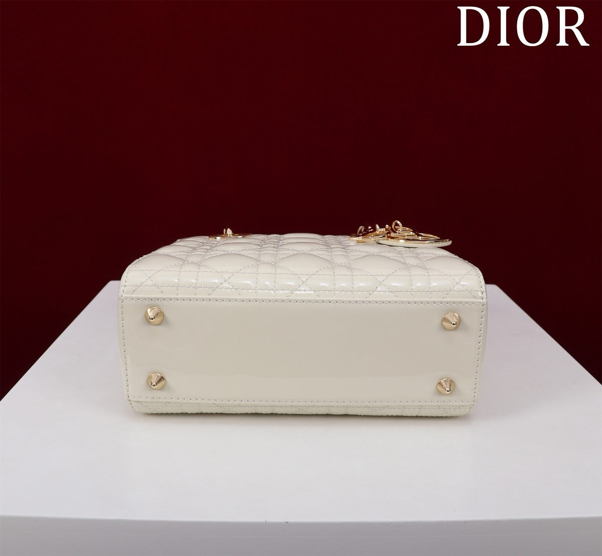 bottom of white patent leather lady dior bag