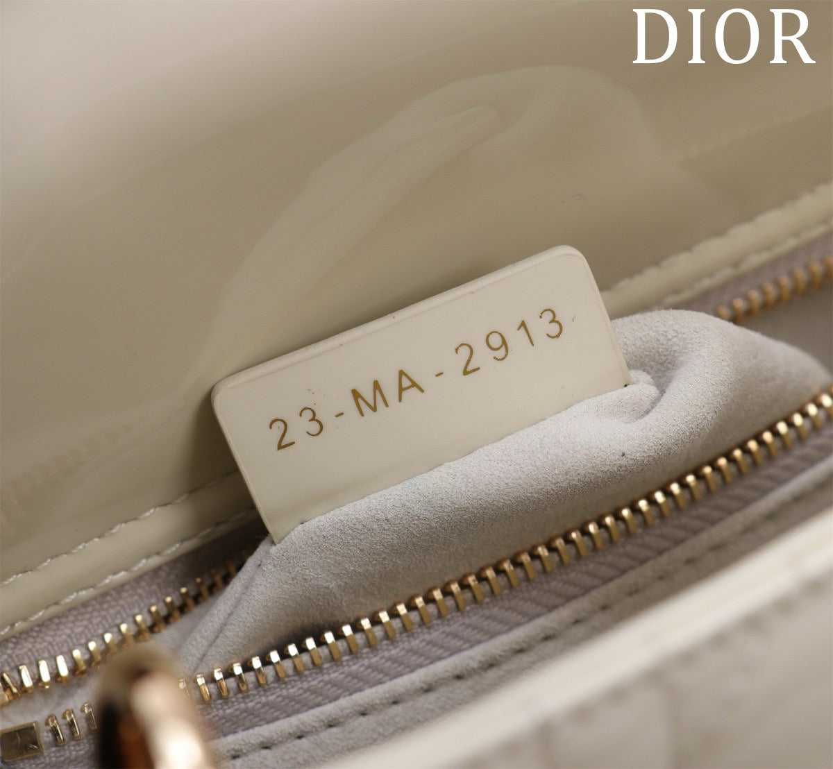 detail of inside of lady dior bag with zipper