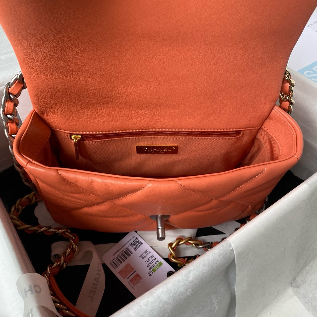 flap opening of Orange chanel 19 handbag in lamb skin and silver hardware