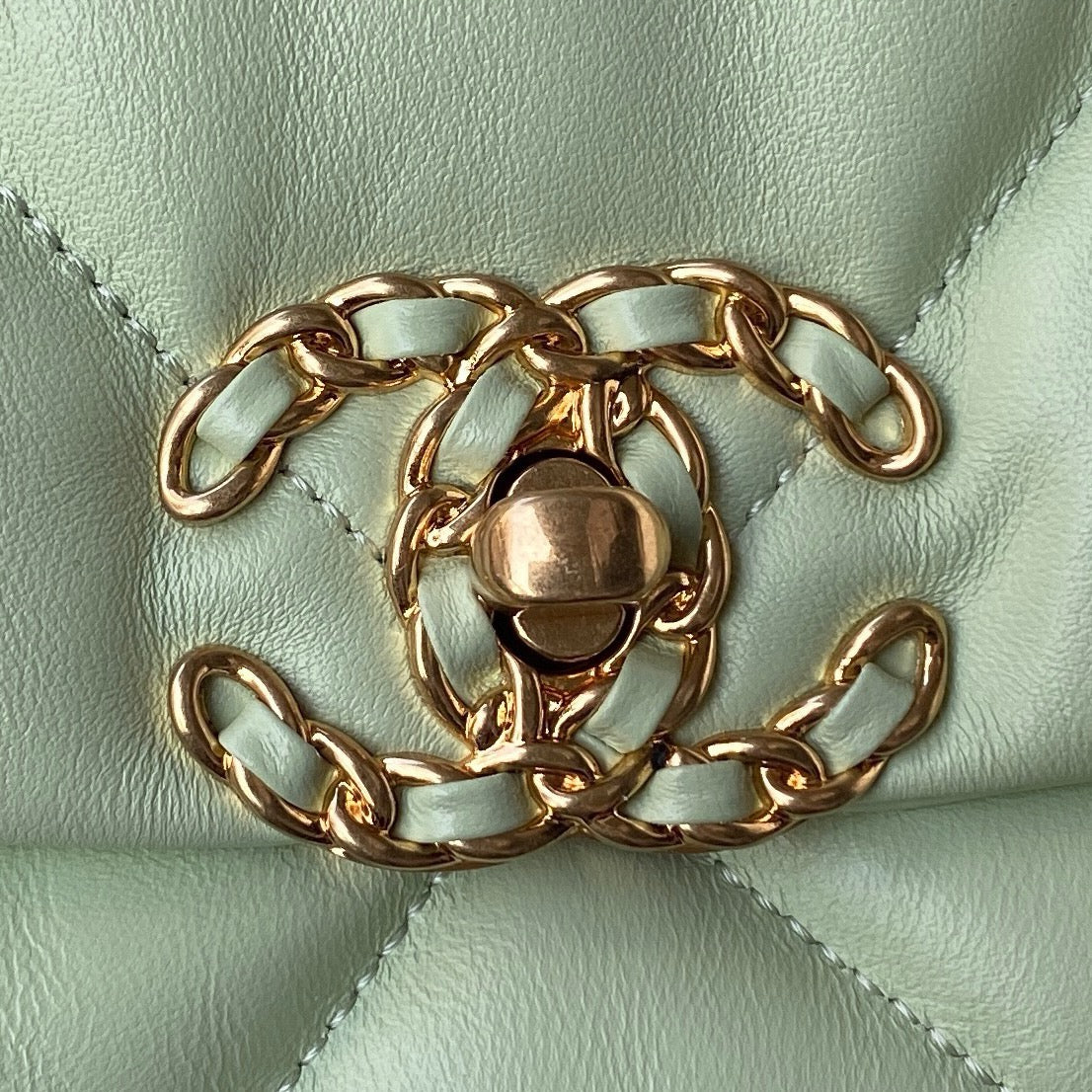 gold chanel logo of Light green large chanel 19 handbag in gold hardware